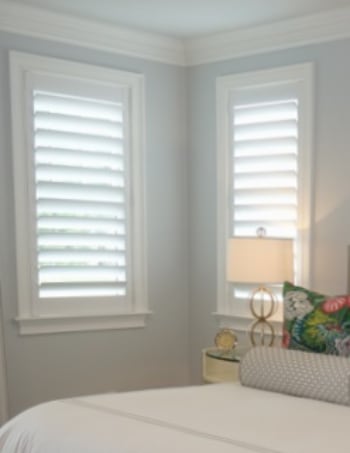 White plantation shutters with hidden tilt rods in Houston